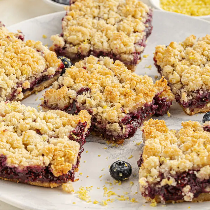 Berry Crumble Bars are easy to make, low carb and bursting with the sweetness of fresh berries! A zesty coconut crumb topping makes these delicious dessert bars even better. No added sugar or flour needed!