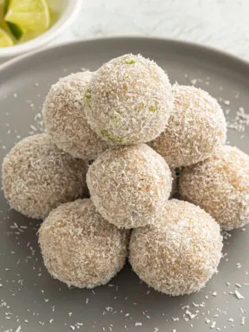 Lime Coconut Energy Balls are healthy truffles with plenty of sweet zesty flavor. Walnuts, lime juice and coconut flakes come together to create delicious keto treats in this easy recipe.