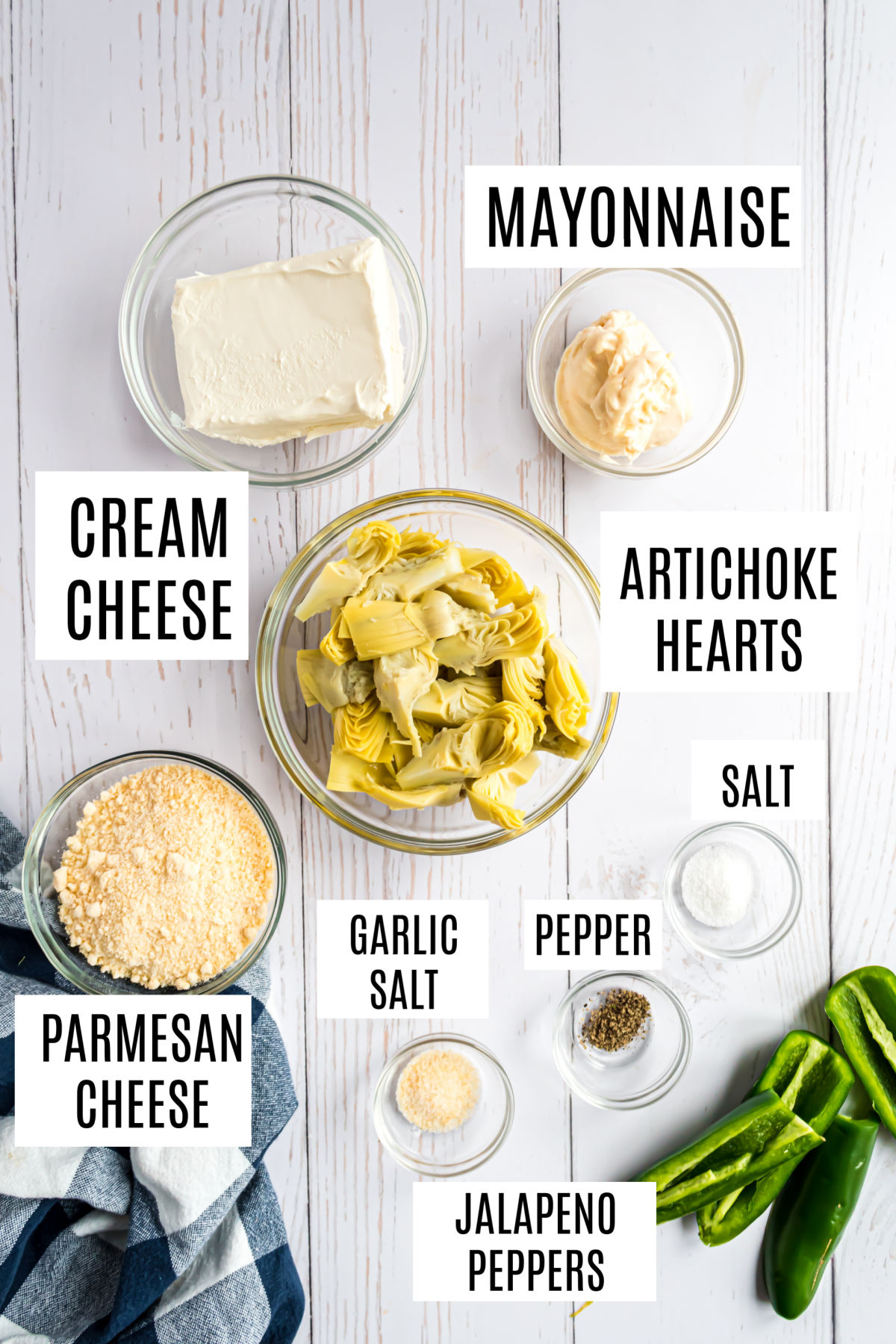 Ingredients needed to make artichoke dip with jalapenos.
