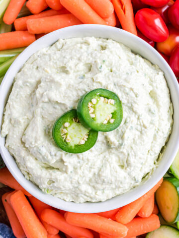 artichoke Jalapeño Dip is a creamy, cheesy dip with the perfect spicy kick. Ready in 10 minutes, this easy low carb dip is a delicious snack or appetizer served with fresh cut veggies!