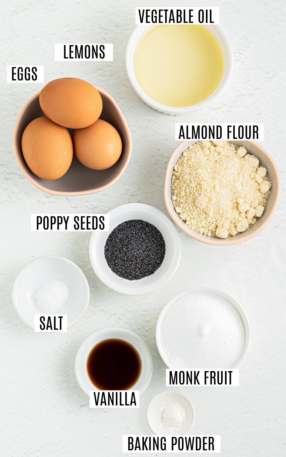 Ingredients needed to make lemon poppy seed muffins.