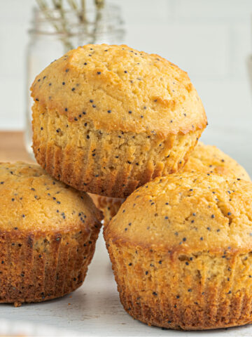 These Lemon Poppy Seed Muffins are moist, sweet and brimming with zesty lemon flavor. Enjoy the delicious taste of homemade muffins without the midmorning sugar crash!