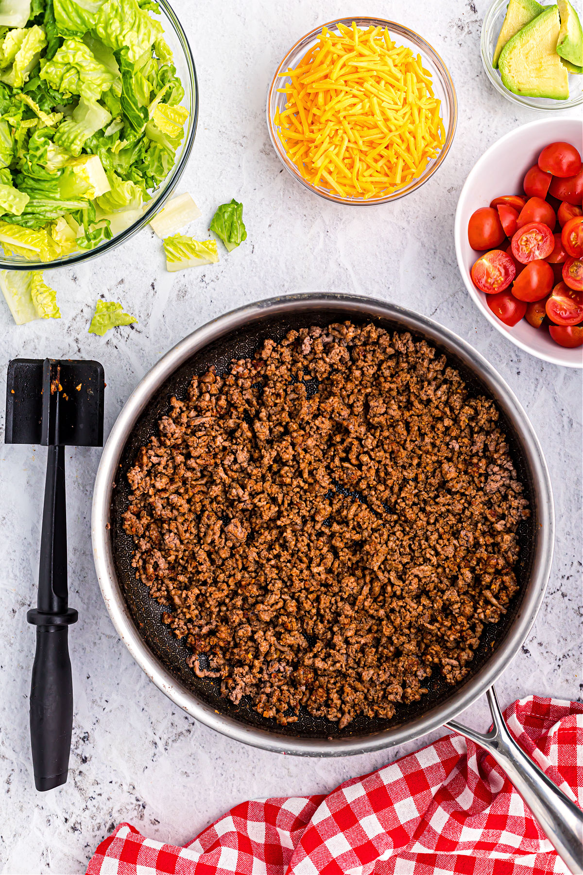 Ground beef cooked in a large skillet.