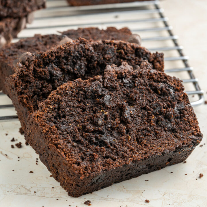 This Chocolate Zucchini Bread is moist, fudgy and sweet enough to serve as a dessert! You won't miss the sugar in this easy, grain-free, sugar-free keto recipe.
