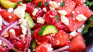 This Watermelon Salad recipe is made with feta, cucumber and a hint of mint in a zesty lime dressing! A refreshing and flavorful addition to any summer dinner table you can make in minutes.