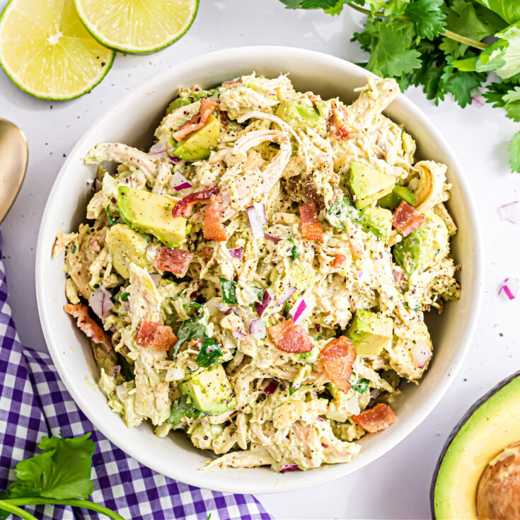 Avocado Chicken Salad is a high protein salad packed with flavor! Bacon, chicken and avocados are tossed with a creamy mayonnaise dressing and the perfect kick of spice for a quick and tasty lunch or dinner.
