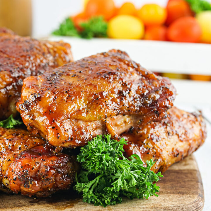 These BBQ Chicken Thighs are a lightened up version of the familiar barbecue dish. Smoked chicken is doused in sugar free barbecue sauce, then smoked a second time for a bold smoky flavor this easy keto recipe.