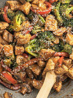 Chicken Stir Fry is an easy, tasty and healthy dinner idea for any night of the week! Succulent chicken, tender veggies and a no-sugar stir-fry sauce come together in this lighting quick recipe.