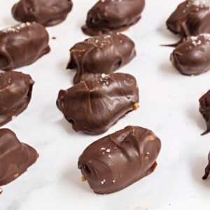 Satisfy your sweet tooth with these healthy Chocolate Dates! Made with just five ingredients and no added sugar, this peanut butter stuffed dates recipe couldn't be any easier.