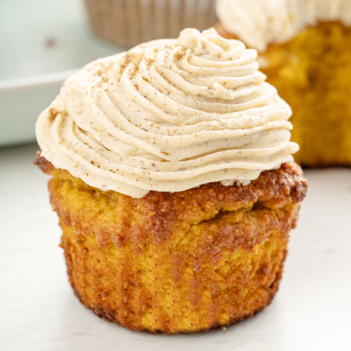 These Pumpkin Cupcakes are moist, flavorful and topped with sugar free cream cheese frosting! Made with real pumpkin and no added sugar, this cupcake recipe is the perfect way to celebrate fall.