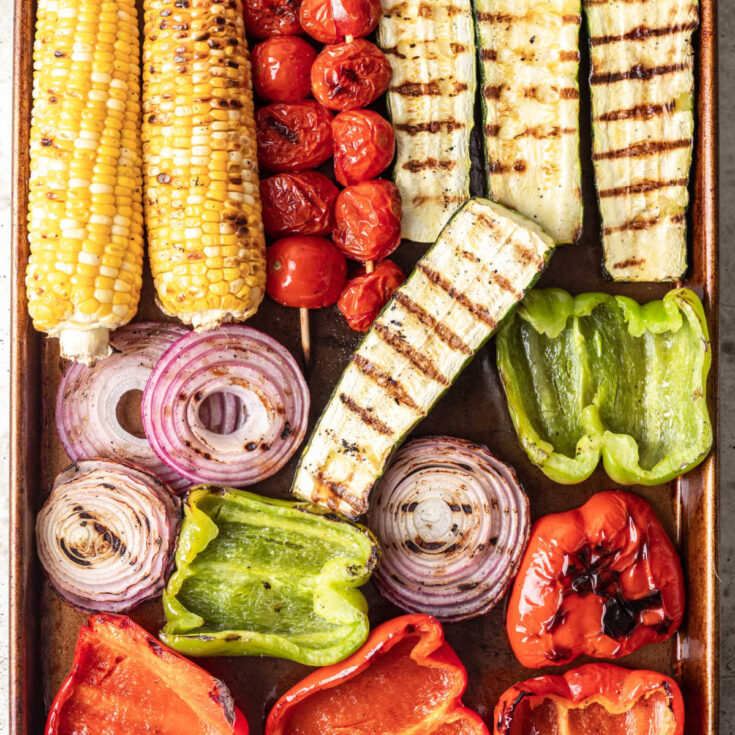 Sheet pan with grilled vegetables.